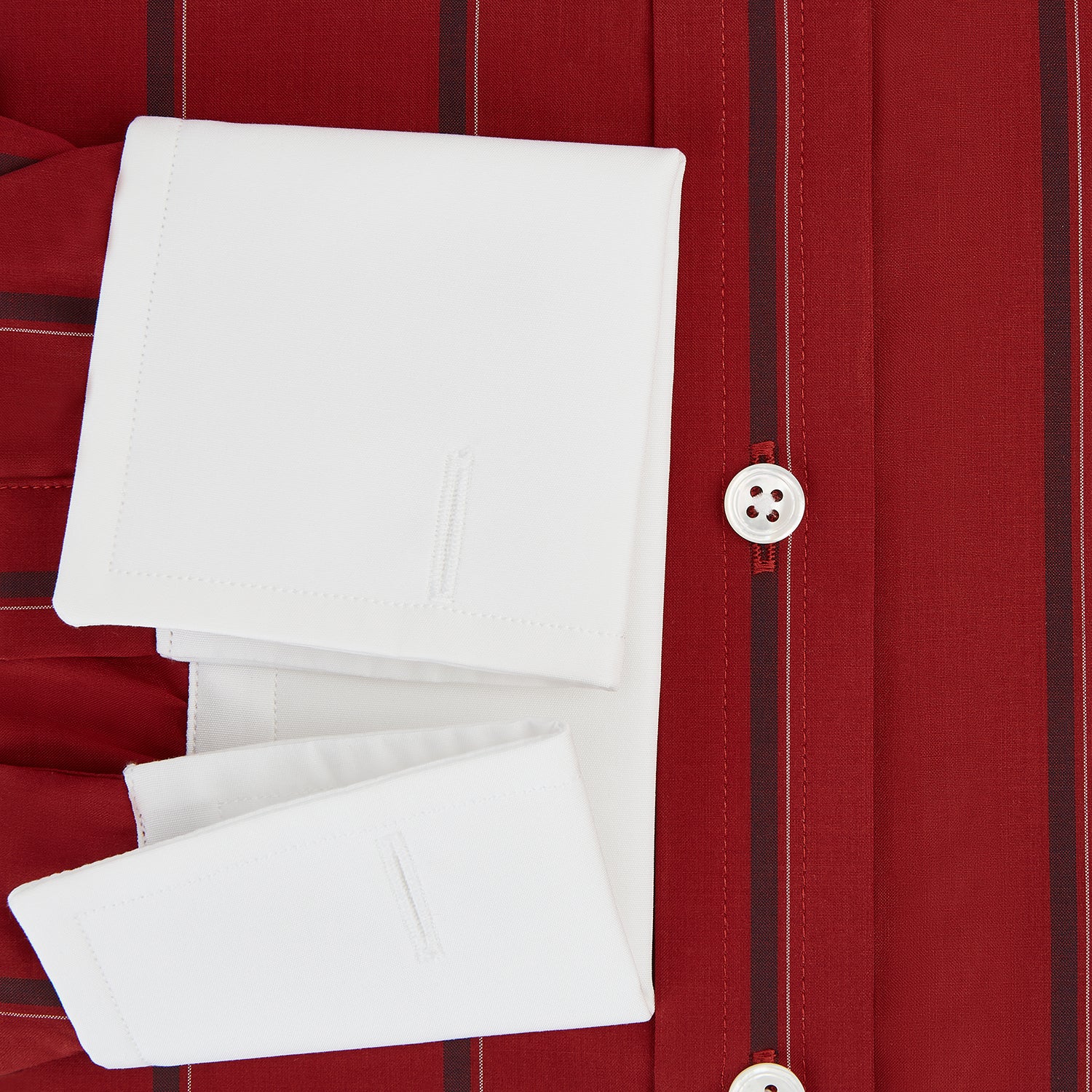 View 4 of product The Turnbull & Asser Dark Red Track Stripe Shirt with Contrast T&A Collar and Cuffs features vertical black stripes, a white collar and cuffs, Mayfair fit, and fine British craftsmanship, shown laid flat on a plain background.
