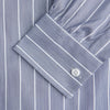 View 2 of product The Turnbull & Asser Pale Blue and White Pinstripe Cotton Blend Weekend Fit Finch Shirt features long sleeves, a chest pocket, and white buttons—ideal for classic, casual style. Shown laid flat on a white background.