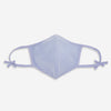 View 1 of product The Turnbull & Asser Blue Fine Check Zephyr Cotton Commuter Mask features a light blue and white check pattern, adjustable side ties, and comes with 3 Viroformula™ filters. Shown on a plain white background.