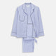The Turnbull & Asser Women's Harriet Blue Bengal Stripe Pyjama Set features premium cotton, a long-sleeve button-up top with chest pocket, and drawstring pants—an ideal gift option.