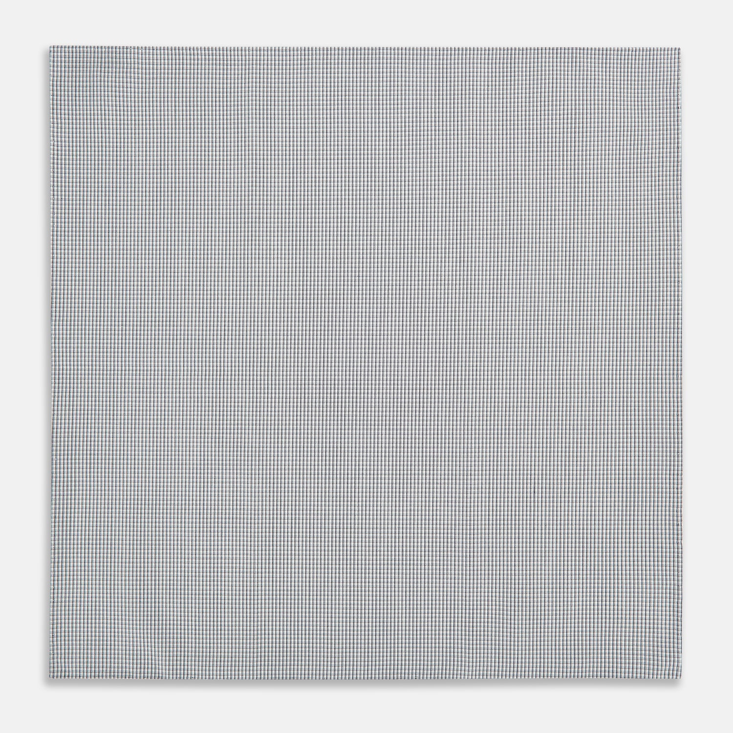 View 3 of product The Turnbull & Asser Navy Blue Shadow Grid Check Hand-Rolled Handkerchief showcases a small, evenly spaced blue and white check pattern and hand-rolled edges, neatly displayed against a white background.