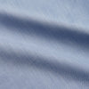 View 4 of product The Turnbull & Asser Slate Blue Chambray Holiday Fit Fellows Shirt features long sleeves and a classic collar, laid flat on a white background—a versatile summer piece for any occasion.