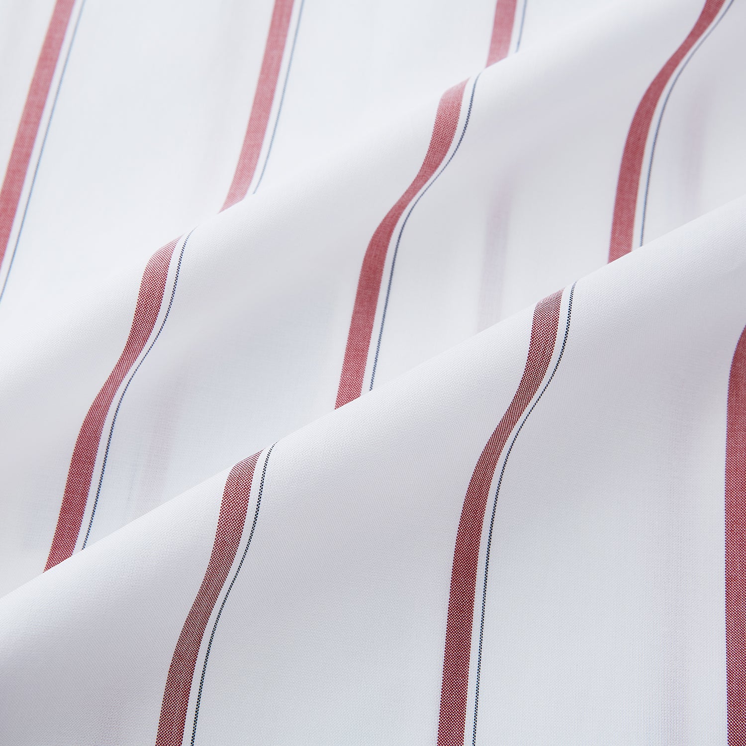 View 6 of product The Turnbull & Asser Dark Red Track Stripe Mayfair Shirt is crafted from Italian cotton, featuring a pointed collar and buttoned cuffs. Displayed against a plain light background.