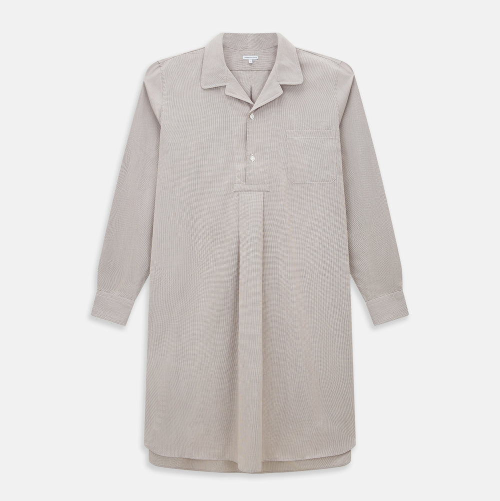 The Turnbull & Asser Brown Micro Check Quarzo Nightshirt is a long-sleeve shirt dress inspired by classic sleepwear, featuring a collar, chest pocket, upper front buttons, and a subtle micro check pattern on a white background.