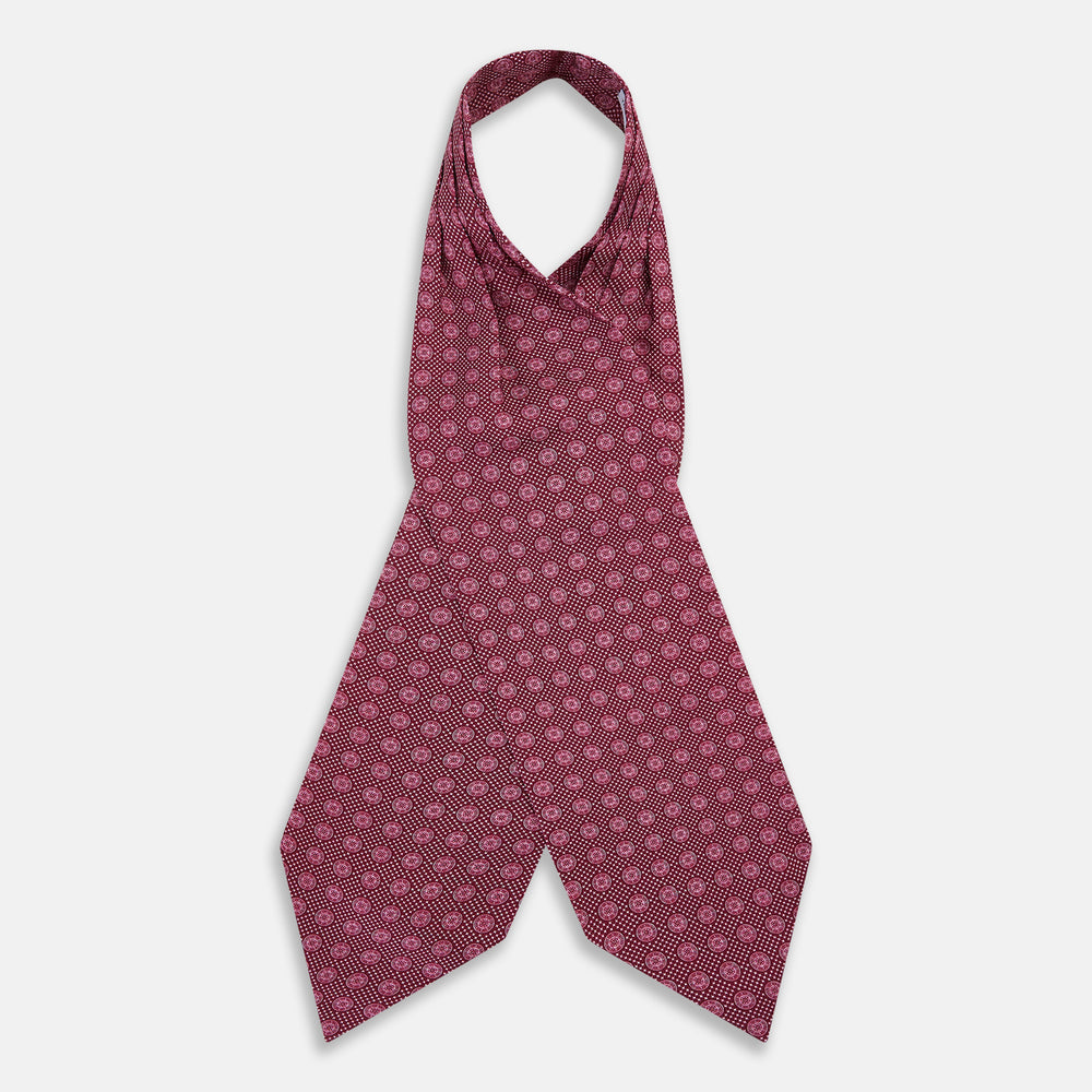 The Burgundy Medallion Silk Cravat by Turnbull & Asser features a white geometric medallion pattern, neatly crafted for an elegant accessory inspired by classic British style.