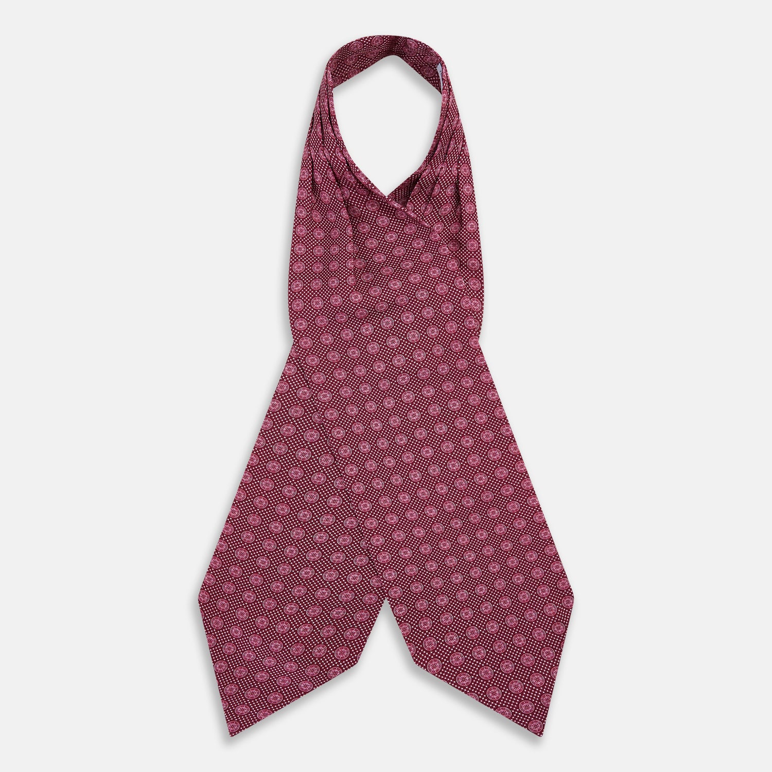 View 2 of product The Burgundy Medallion Silk Cravat by Turnbull & Asser features a white geometric medallion pattern, neatly crafted for an elegant accessory inspired by classic British style.