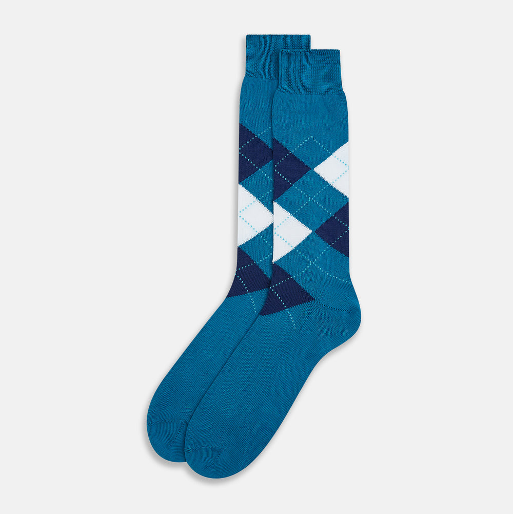 The Turnbull & Asser Azzurro Check Mid-Length Socks feature a classic argyle pattern in navy, white, and dark teal on teal cotton, with ribbed tops for a polished look and added comfort.