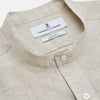 View 2 of product The Turnbull & Asser Light Oatmeal Linen Weekend Fit Unwin Shirt features long sleeves, a band collar, and two chest pockets—an ideal choice for effortless summer style.
