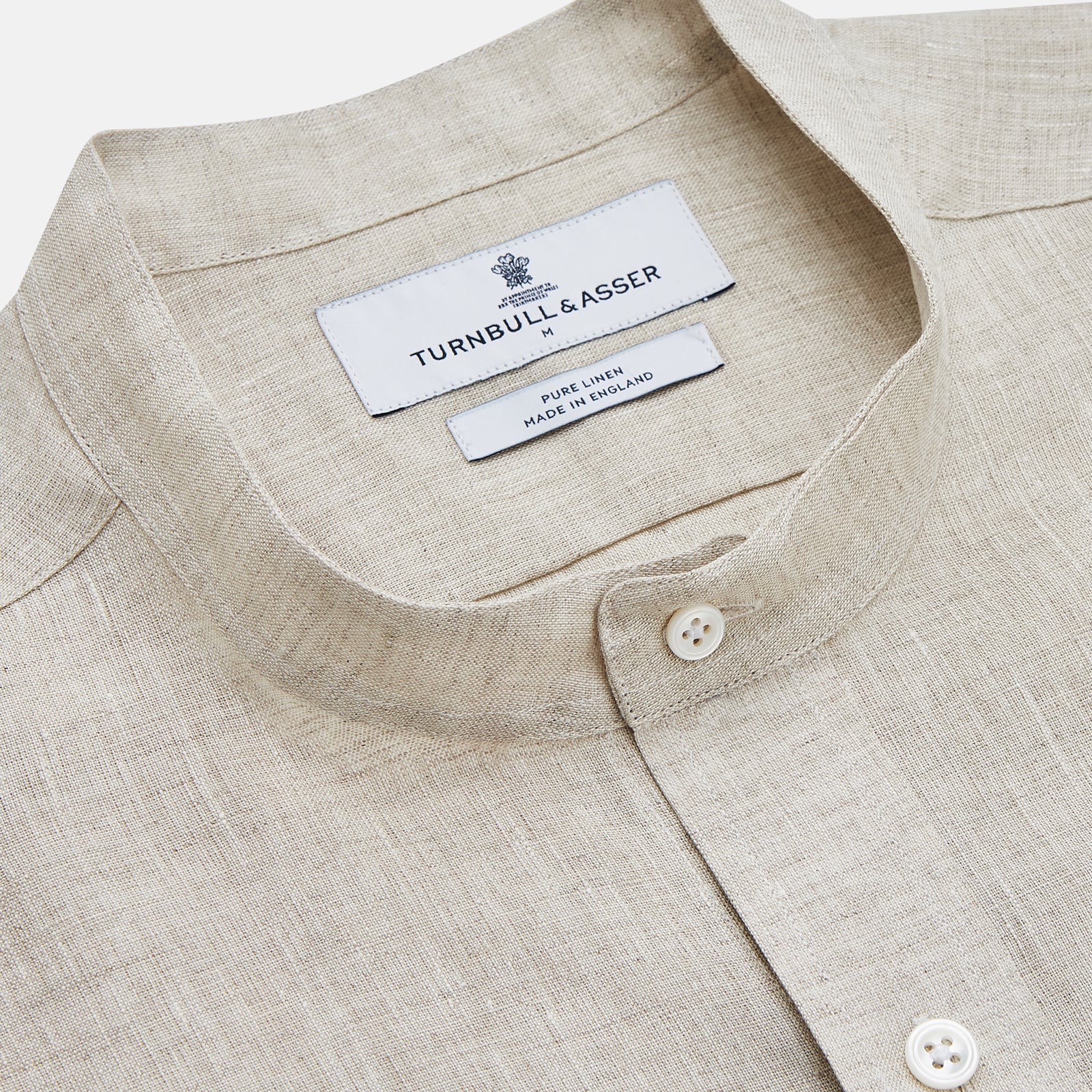 View 2 of product The Turnbull & Asser Light Oatmeal Linen Weekend Fit Unwin Shirt features long sleeves, a band collar, and two chest pockets—an ideal choice for effortless summer style.