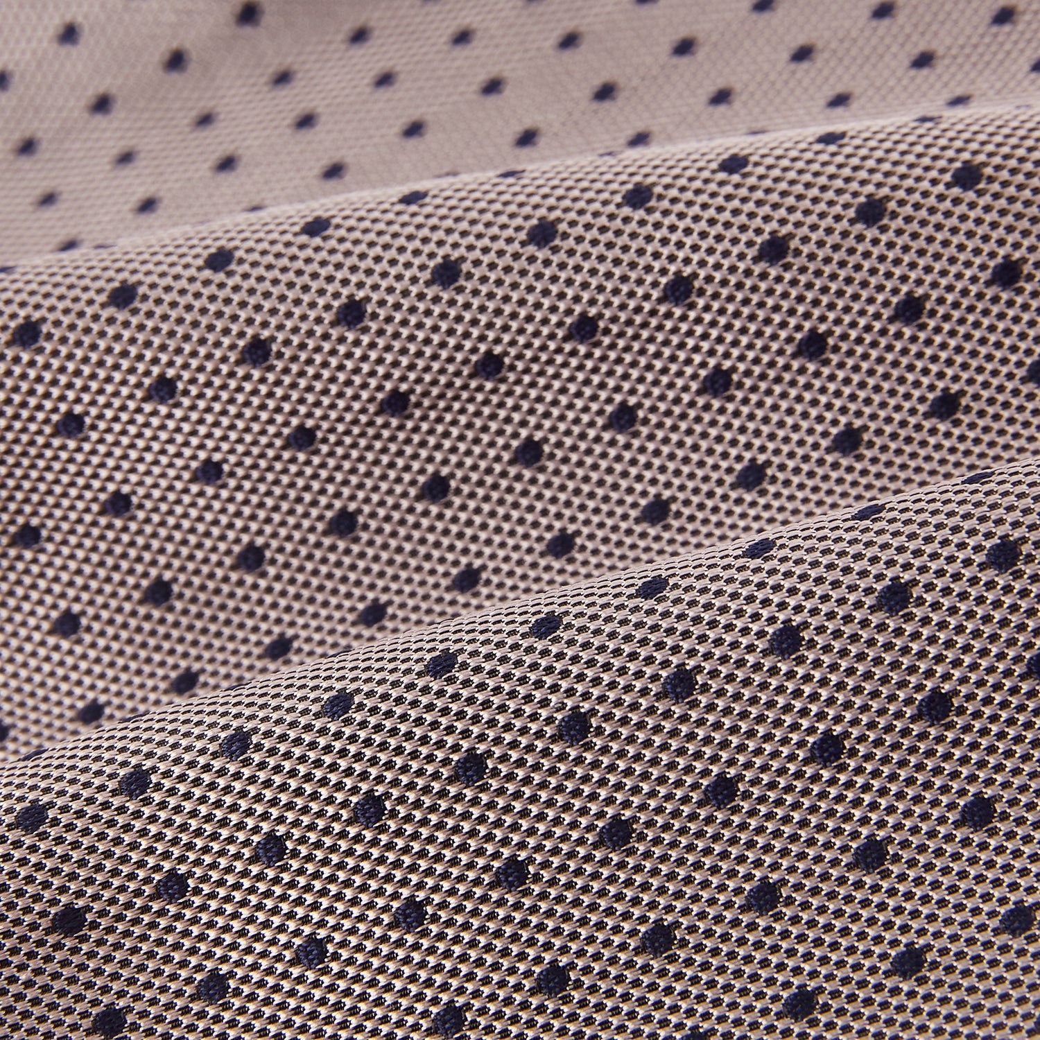 View 4 of product A folded, light-colored pocket square with small dark dots is displayed on a white background. Neatly arranged in a pointed fold, it pairs perfectly with the Turnbull & Asser Lilac and Navy Micro Dot Silk Cravat for an elegant look.