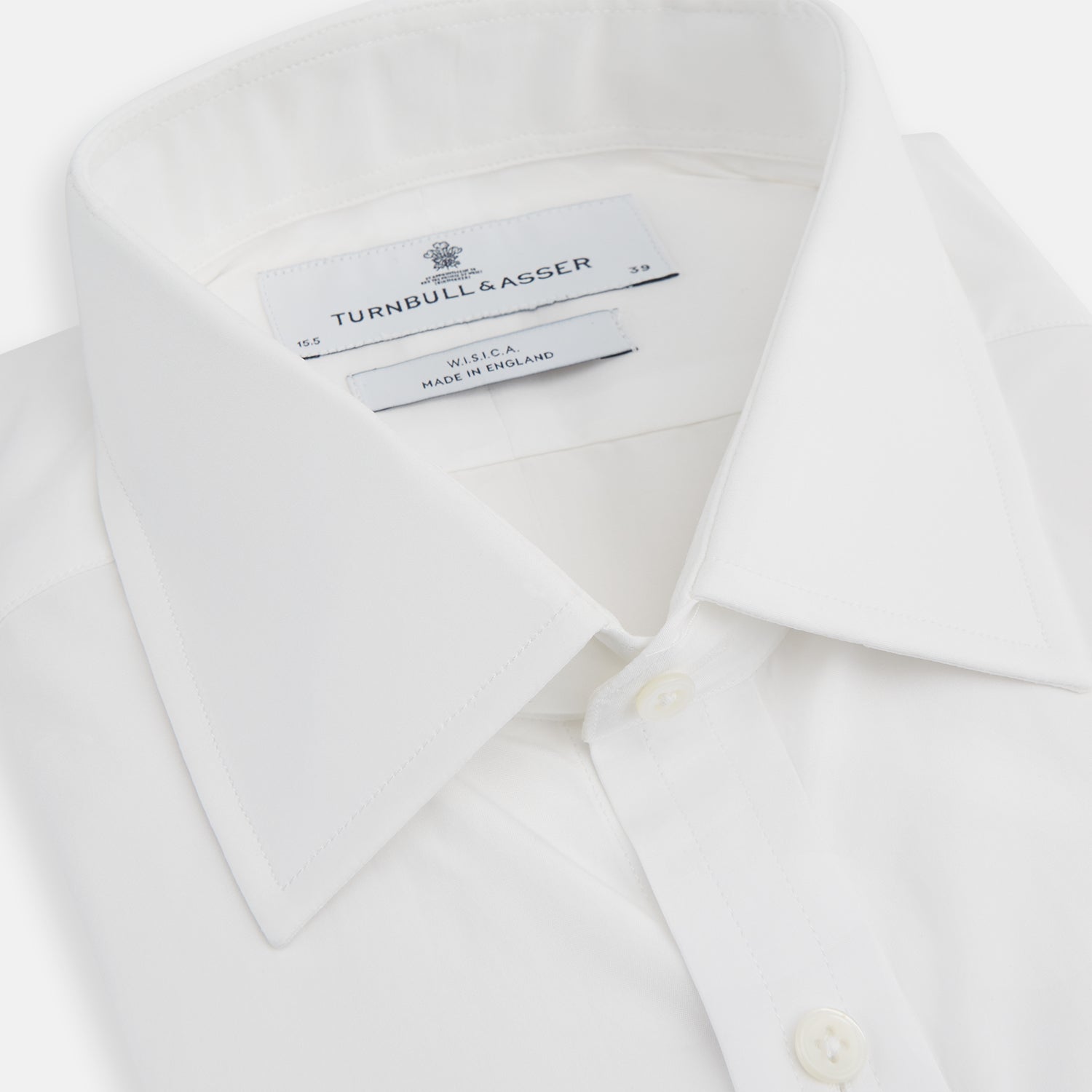 View 2 of product The Turnbull & Asser White West Indian Sea Island Cotton Shirt features a T&A collar, 3-button cuffs, and is crafted from luxurious long-staple cotton for exceptional softness. Displayed against a white background.