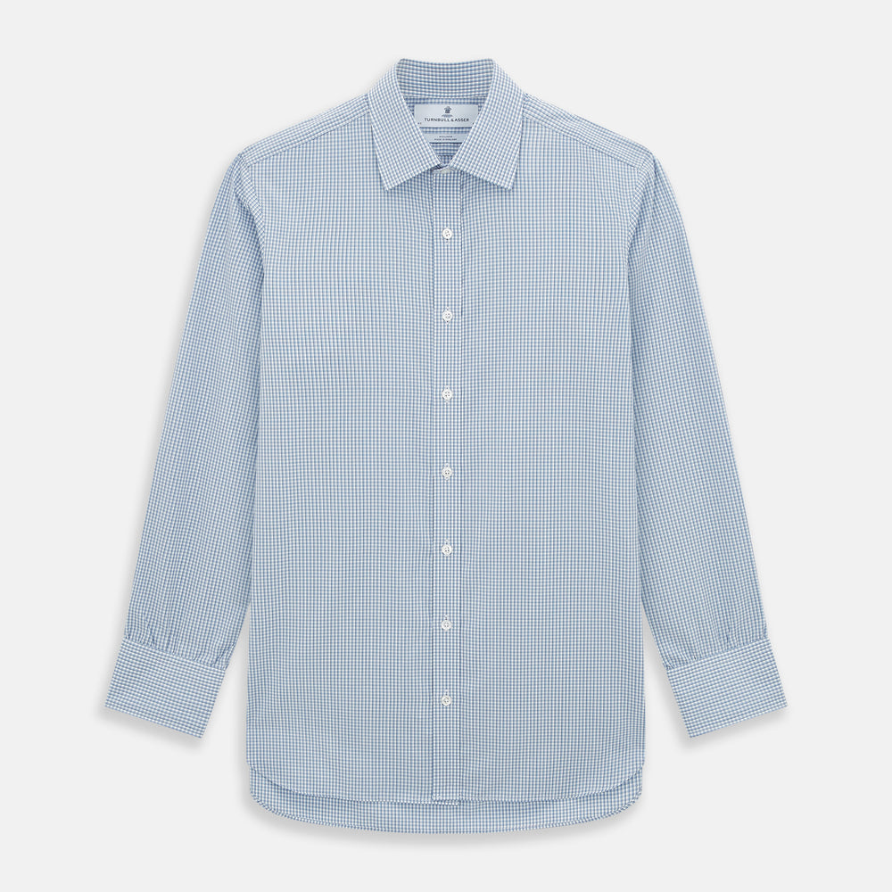 The Turnbull & Asser Blue Micro Shadow Check Mayfair Shirt features a long-sleeve, button-up design with a small blue and white check pattern, pointed T&A collar, and classic cuffs.
