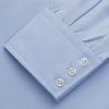 View 4 of product Turnbull & Asser's Tailored Fit Blue Cotton Shirt features a Kent collar, 3-button cuffs, and a clean design—ideal with a navy suit. Displayed on a plain white background.