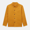 View 1 of product The Turnbull & Asser Ochre Cotton-Linen Remy Chore Jacket features a collar, long sleeves, brown front buttons, and three patch pockets, shown on a plain white background.