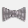 View 1 of product The Turnbull & Asser Grey and White Diamond Silk Bow Tie showcases a subtle diamond pattern, ideal for formalwear, and is elegantly displayed against a plain white background.