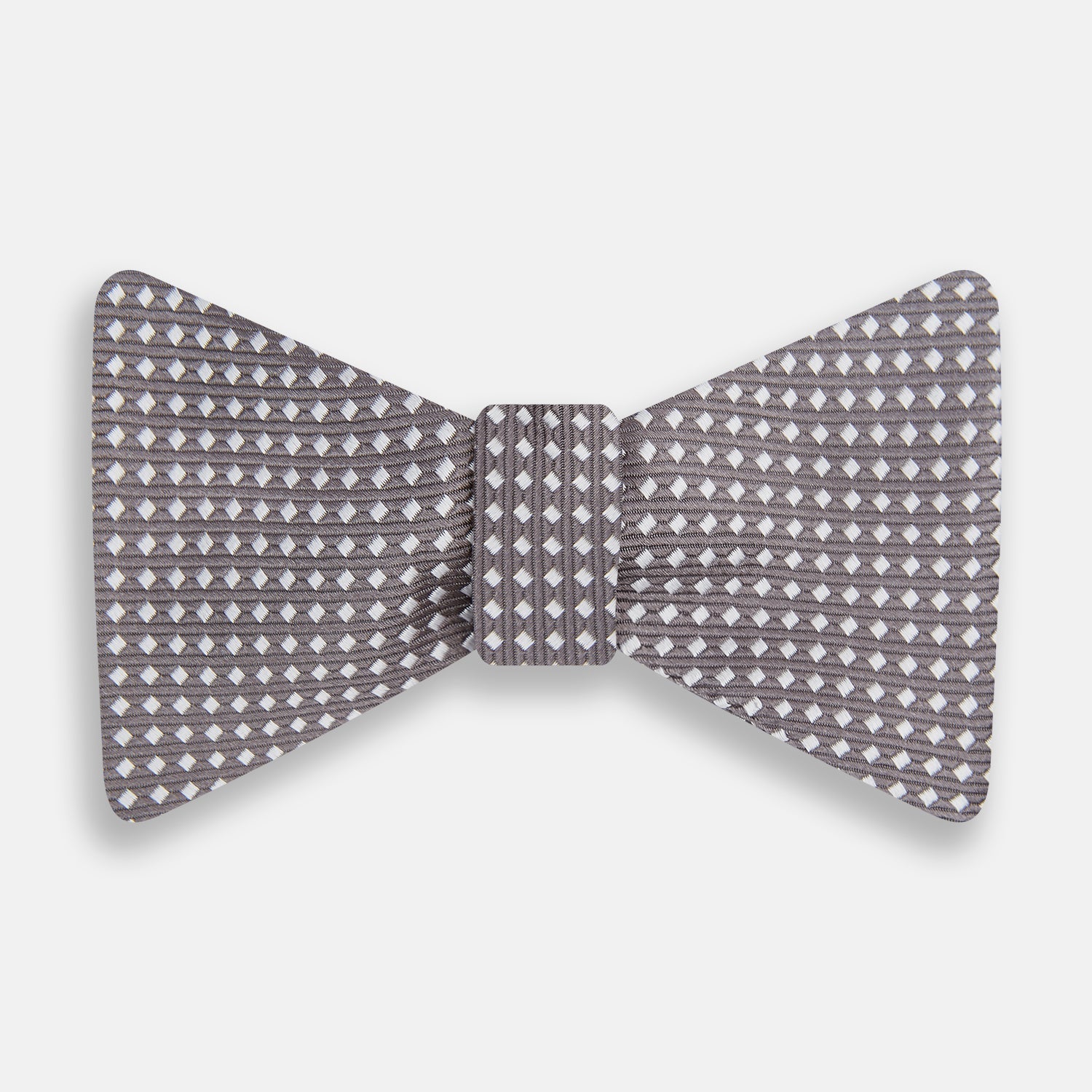 View 1 of product The Turnbull & Asser Grey and White Diamond Silk Bow Tie showcases a subtle diamond pattern, ideal for formalwear, and is elegantly displayed against a plain white background.
