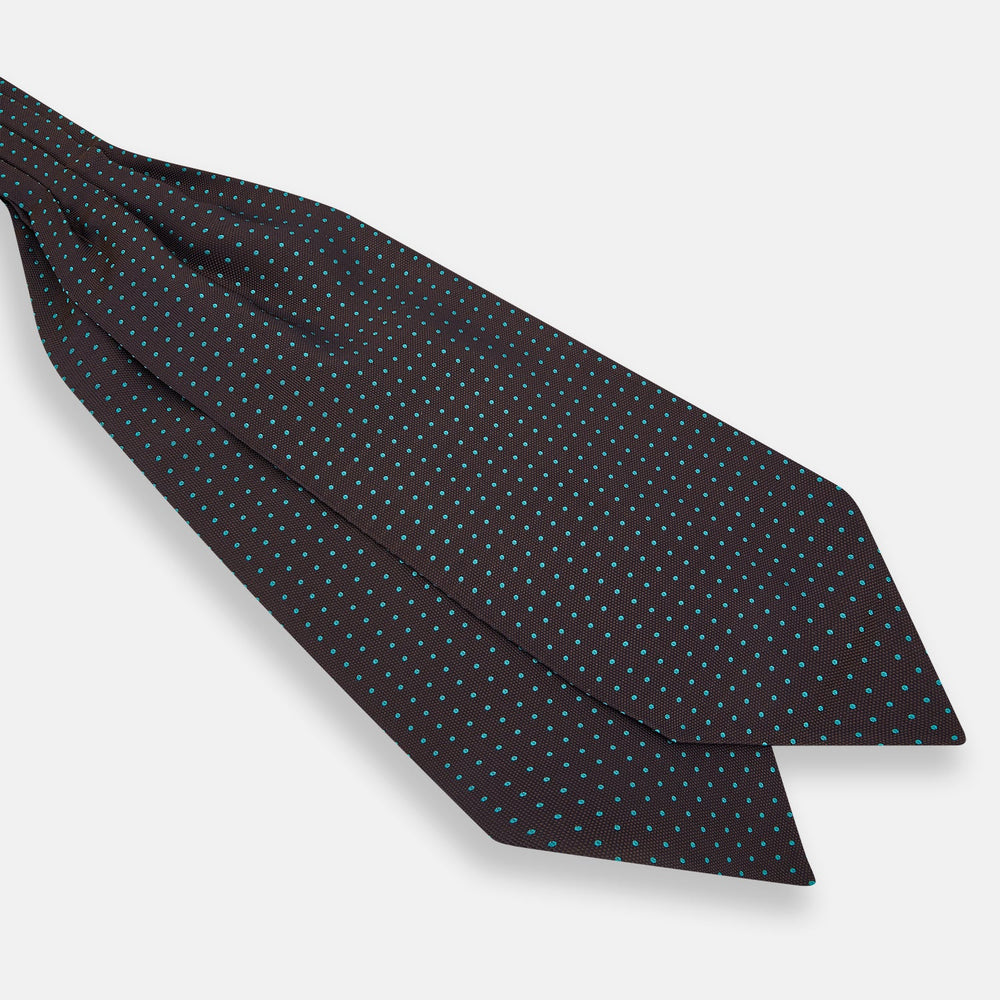 The Turnbull & Asser Blue and Dark Brown Micro Dot Silk Cravat features evenly spaced blue micro dots on dark brown silk, displayed neatly folded on a white background.