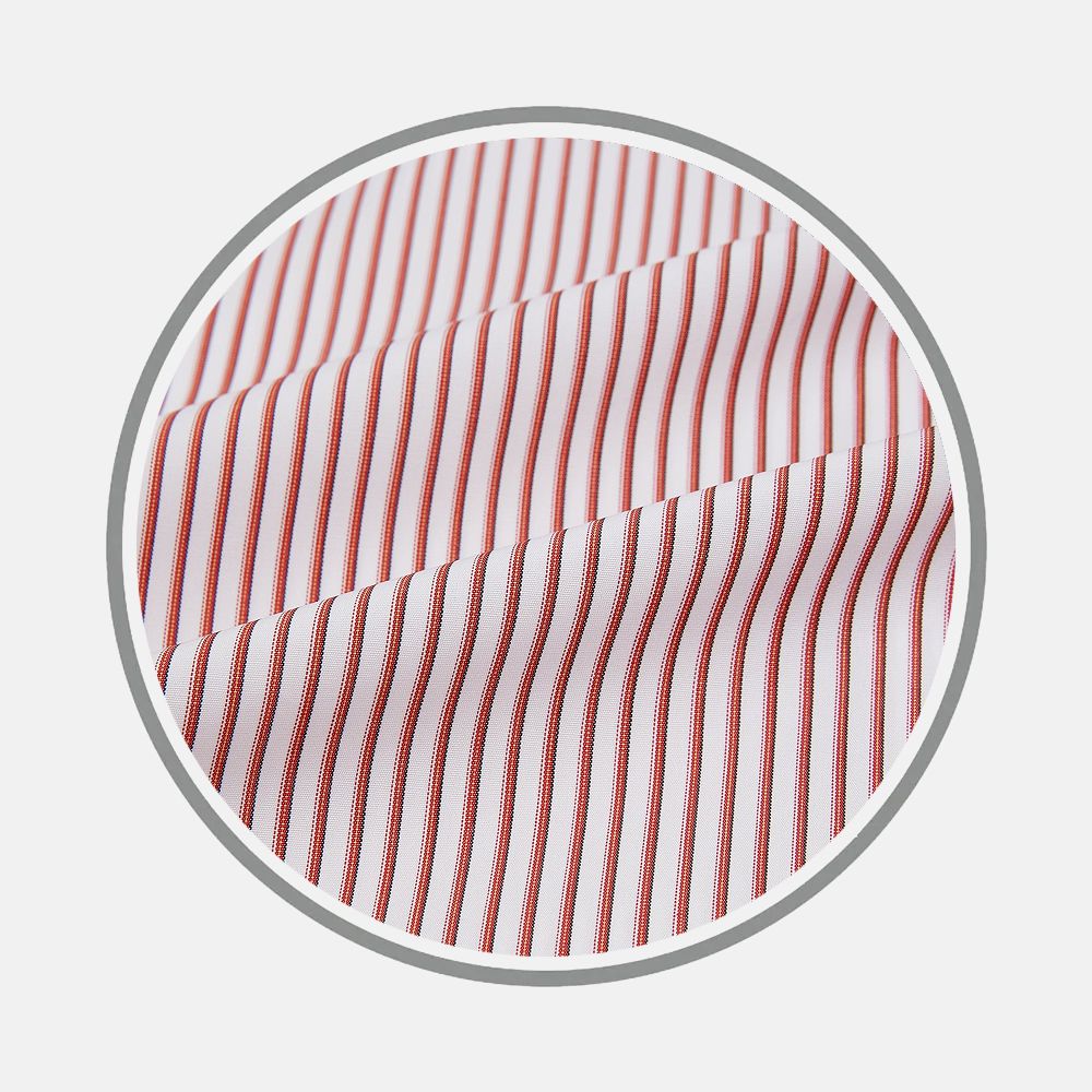 Close-up of Turnbull & Asser’s Red Shadow Stripe Fabric—white material with evenly spaced vertical red stripes—displayed in a circular frame against a plain light background.