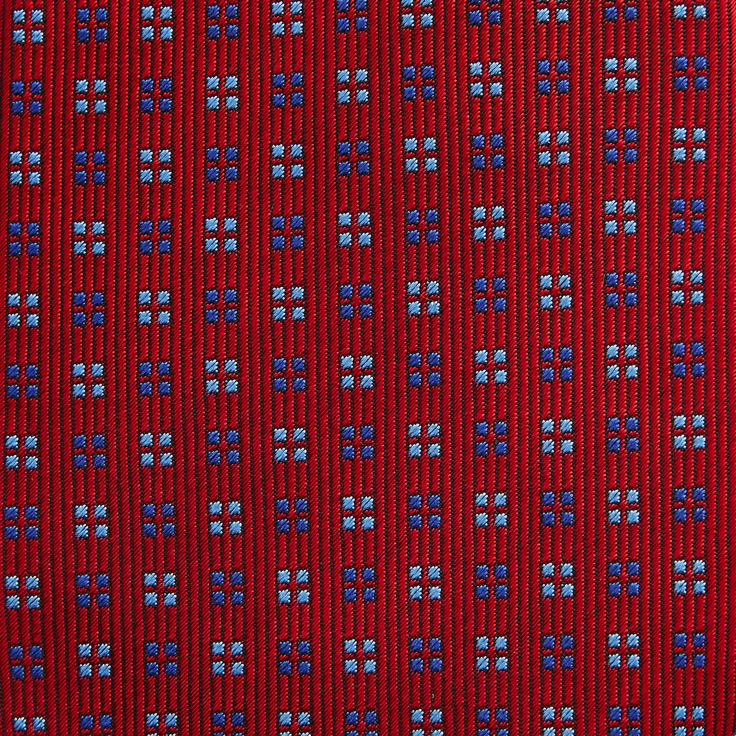 View 3 of product The Turnbull & Asser MINI SQUARE SPOT TULIP RED BLUE TIE features a vivid red base with blue and white geometric spots, making it a stylish addition to any refined ensemble.