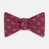 View 1 of product The Turnbull & Asser Burgundy Medallion Silk Bow Tie, featuring small white circles and crosshatch lines, is displayed on a plain white background—perfect for adding sophistication to smart attire.