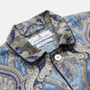 View 2 of product The Turnbull & Asser Pale Blue Baroque Silk-blend Hyde Pyjama Set features a long-sleeve button-up shirt and pants in a blue and beige paisley pattern, shown flat on a white background.