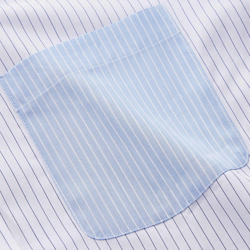 The White and Blue Stripe Cotton RE-PURPOSE Weekend Fit Finch Shirt by Turnbull & Asser features long sleeves, thin blue stripes, a light blue chest pocket, and is crafted sustainably.