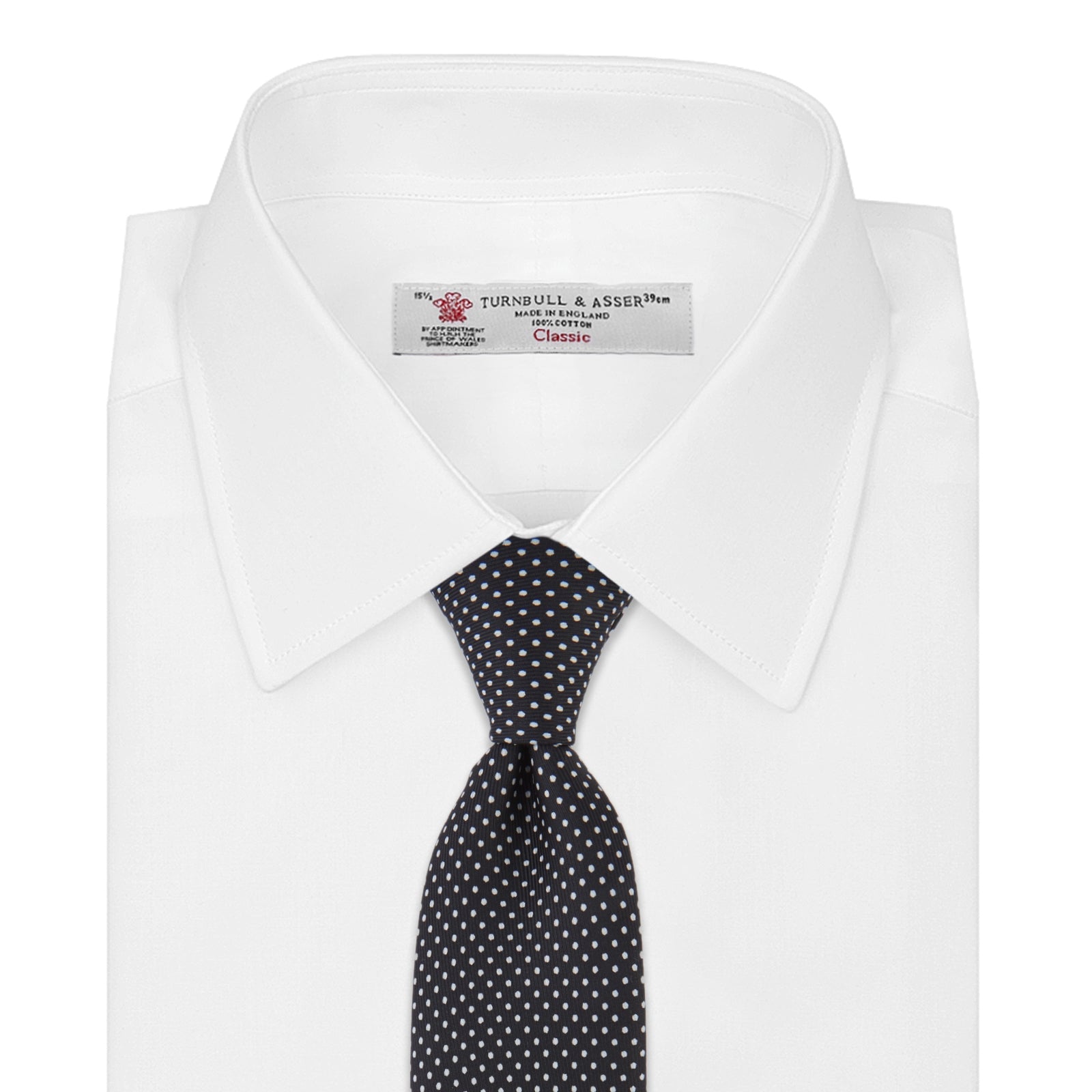 View 2 of product The Turnbull & Asser Black and White Spot Printed Silk Tie, shown neatly rolled on a plain white background, is an essential accessory to elevate any smart attire.