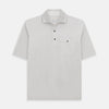 View 1 of product The Turnbull & Asser Pale Pink Polo Shirt is a cotton jersey short-sleeve polo with a collar, three brown buttons on the placket, and a button-flap chest pocket, shown against a white background.