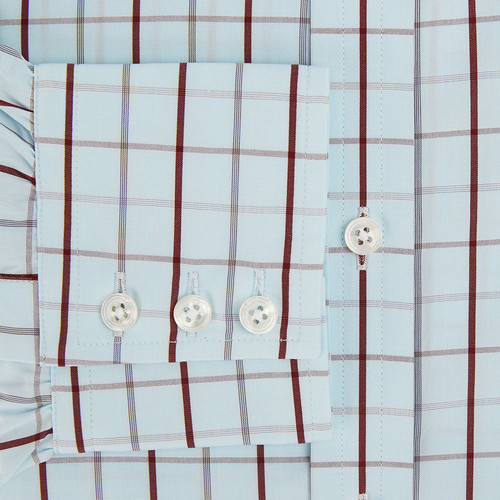 The Turnbull & Asser Burgundy Combination Check Mayfair Shirt is a long-sleeve button-up dress shirt with a check pattern, ideal for formal wear and shown on a plain white background.