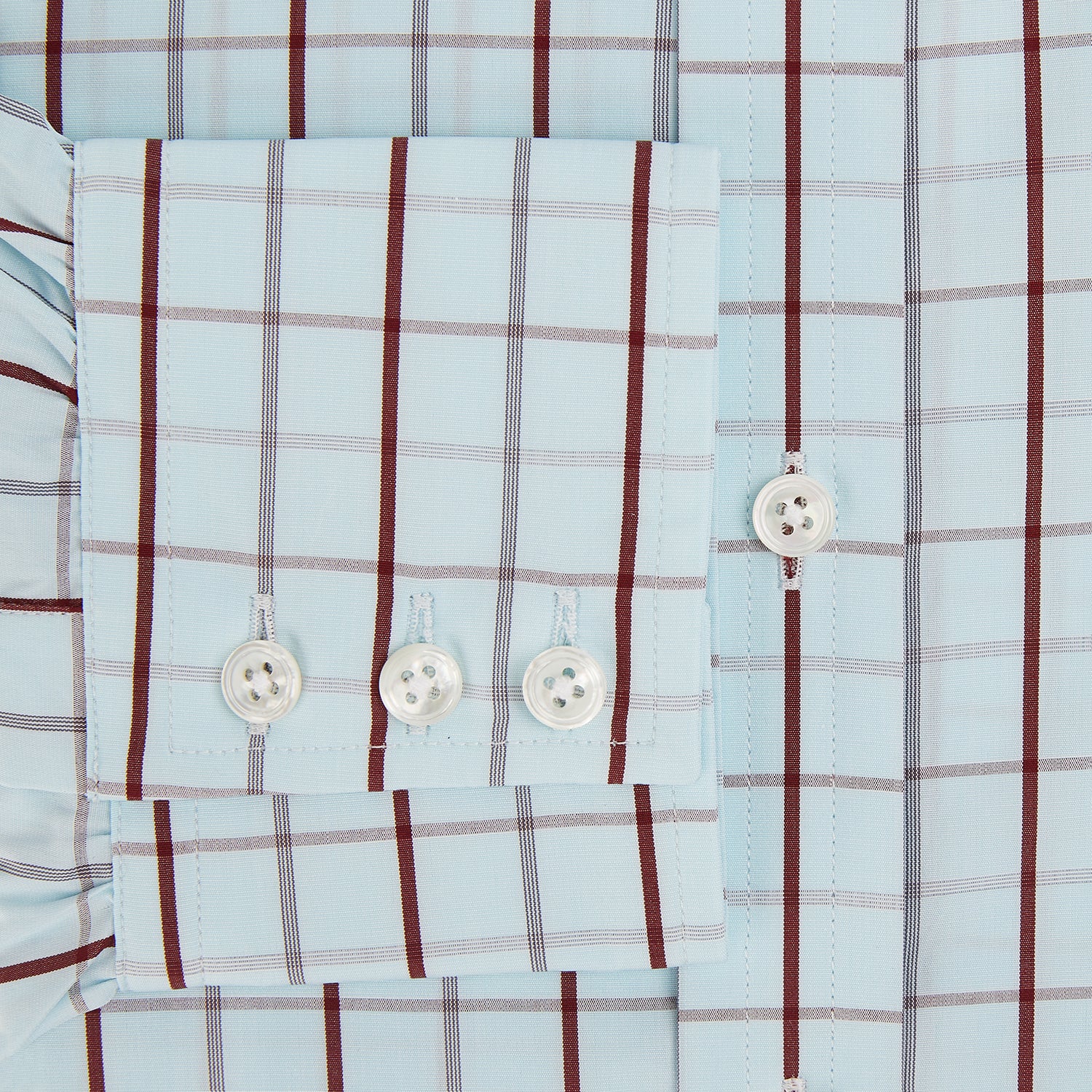 View 4 of product The Turnbull & Asser Burgundy Combination Check Mayfair Shirt is a long-sleeve button-up dress shirt with a check pattern, ideal for formal wear and shown on a plain white background.