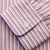View 5 of product The Orange Multi Stripe Cotton Sussex Nightshirt by Turnbull & Asser features a classic collar, red and white vertical stripes, a chest pocket with blue trim, button-down front, and curved hem—a luxe take on the traditional nightshirt.