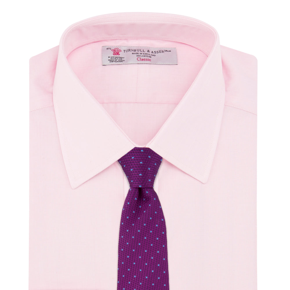 The Pink End-on-End Shirt with T&A Collar and Double Cuffs by Turnbull & Asser, shown neatly folded on a white background, updates timeless elegance with its classic detailing and refined pink hue.