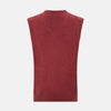 View 3 of product A refined piece from Turnbull & Asser, the Antique Pink Cashmere V-Neck Vest features a sleeveless design with a ribbed hem, shown against a plain white background.
