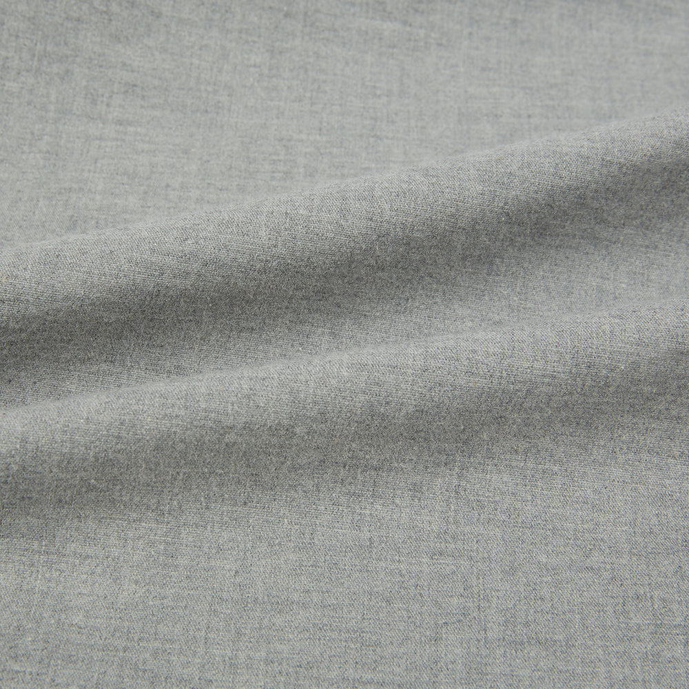 The Grey Westminster Shirt by Turnbull & Asser features a classic collar and white buttons, expertly crafted in Britain. This long-sleeve button-up is shown against a plain white background.