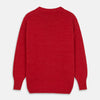 View 6 of product The Red Lewis Guernsey Knitted Jumper by Turnbull & Asser is a bright red wool-cotton, long-sleeve jumper with a round neckline, ribbed cuffs, and ribbed hem, shown against a white background.