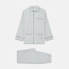 View 1 of product The Turnbull & Asser Green and Blue Check Cotton Hyde Pyjama Set for men features a long-sleeve, button-up top and pants with contrasting dark piping, shown laid flat on a white background.
