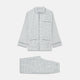 The Turnbull & Asser Green and Blue Check Cotton Hyde Pyjama Set for men features a long-sleeve, button-up top and pants with contrasting dark piping, shown laid flat on a white background.