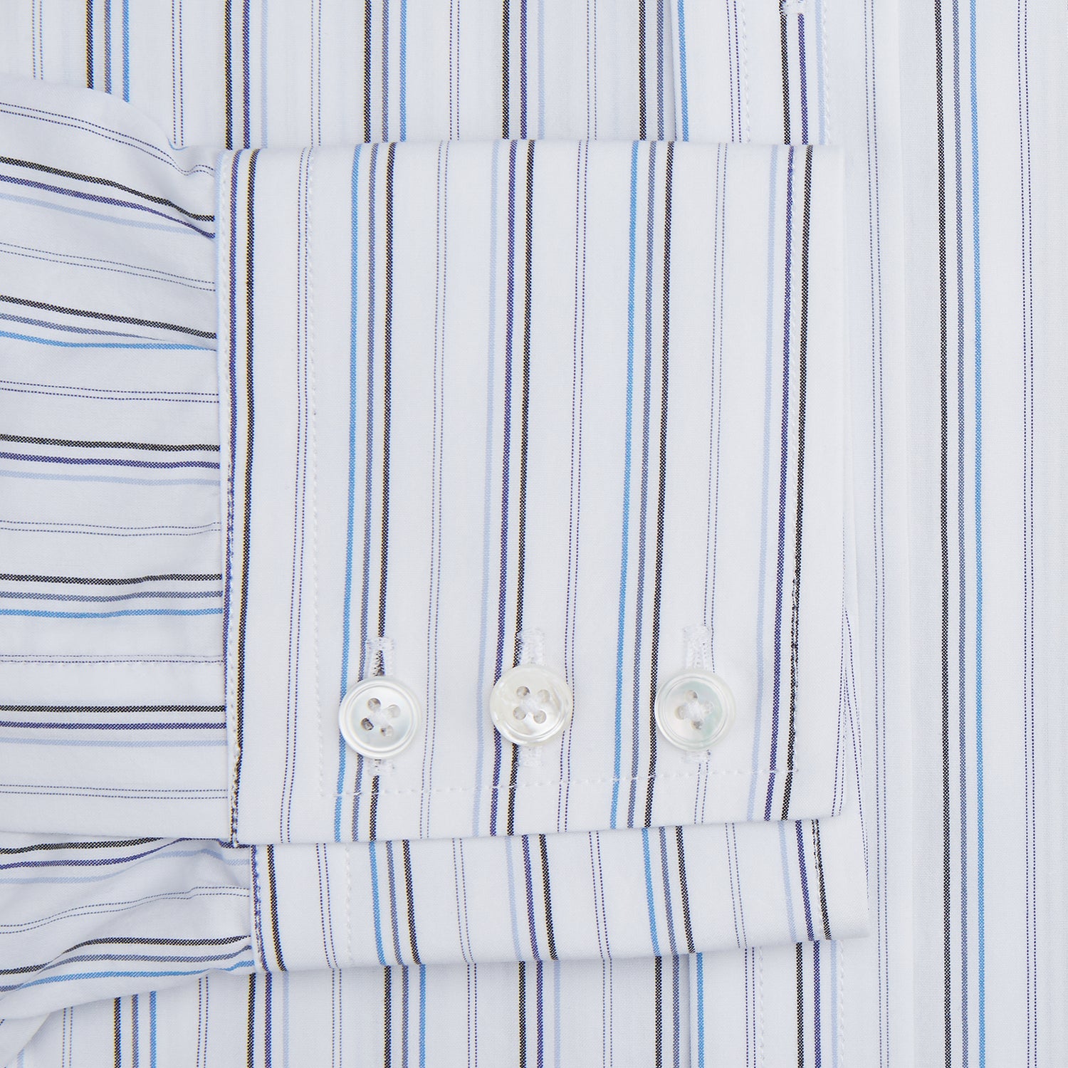 View 3 of product The Turnbull & Asser Blue Fine Multi Pinstripe Mayfair Shirt features long sleeves, an organic cotton build, a T&A collar, and vertical blue stripes. Laid neatly on a white background.