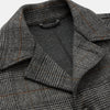 View 2 of product The Turnbull & Asser Grey Multi Check Wool Bernard Car Coat features a collar, three front buttons, long sleeves, and knee-length Prince of Wales check wool, shown against a white background.