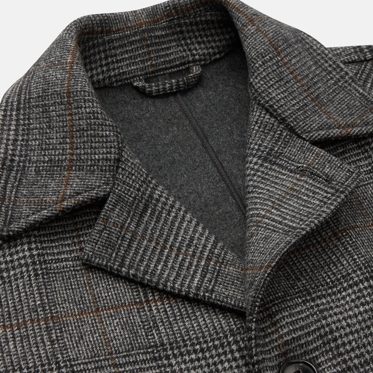 View 2 of product The Turnbull & Asser Grey Multi Check Wool Bernard Car Coat features a collar, three front buttons, long sleeves, and knee-length Prince of Wales check wool, shown against a white background.