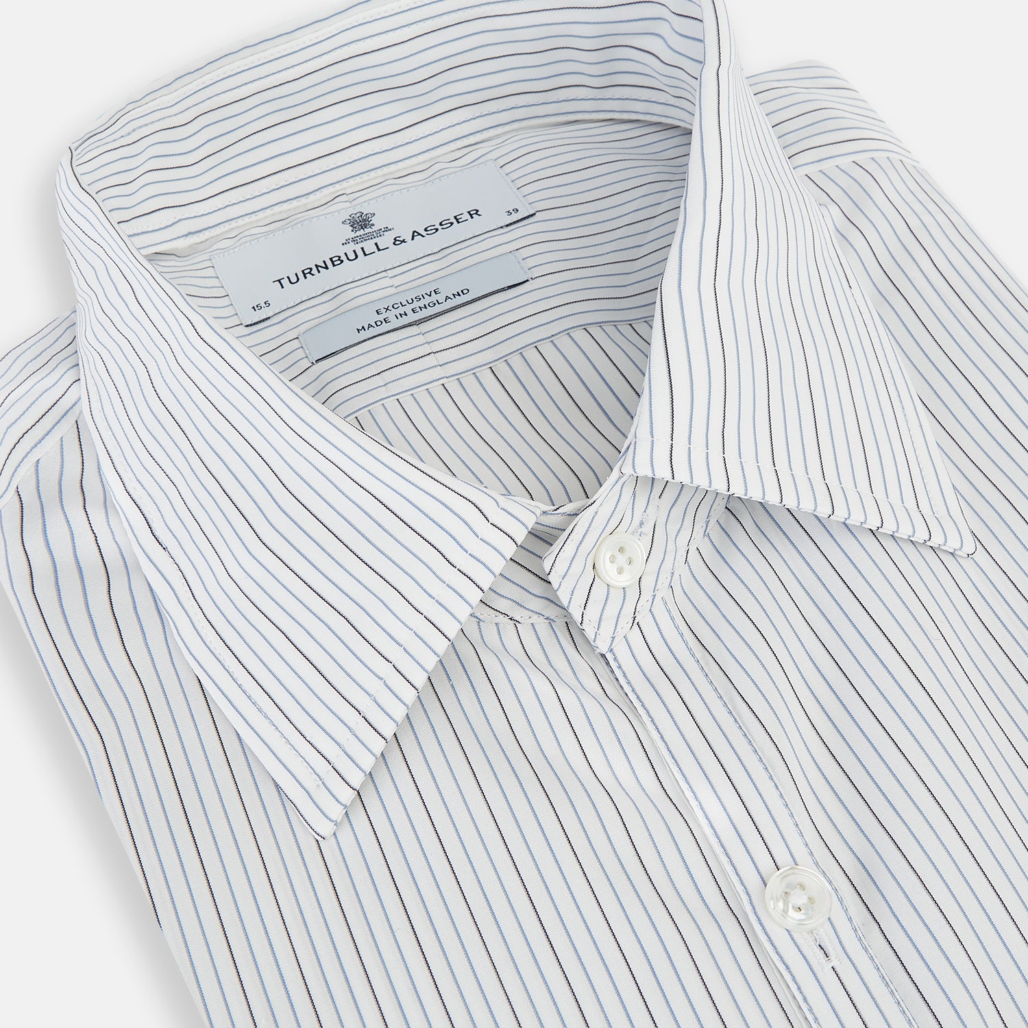 View 2 of product The Turnbull & Asser Grey and Blue Pinstripe Westminster Shirt features fine stripes, a classic collar, and buttoned cuffs—showcasing signature British craftsmanship against a plain white backdrop.
