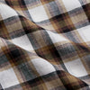 View 4 of product The Turnbull & Asser Brown Multi Check Linen Weekend Fit Hayne Shirt is a long-sleeve, button-up with a Dorset collar and buttoned cuffs, shown flat on a white background. It features a classic plaid pattern.