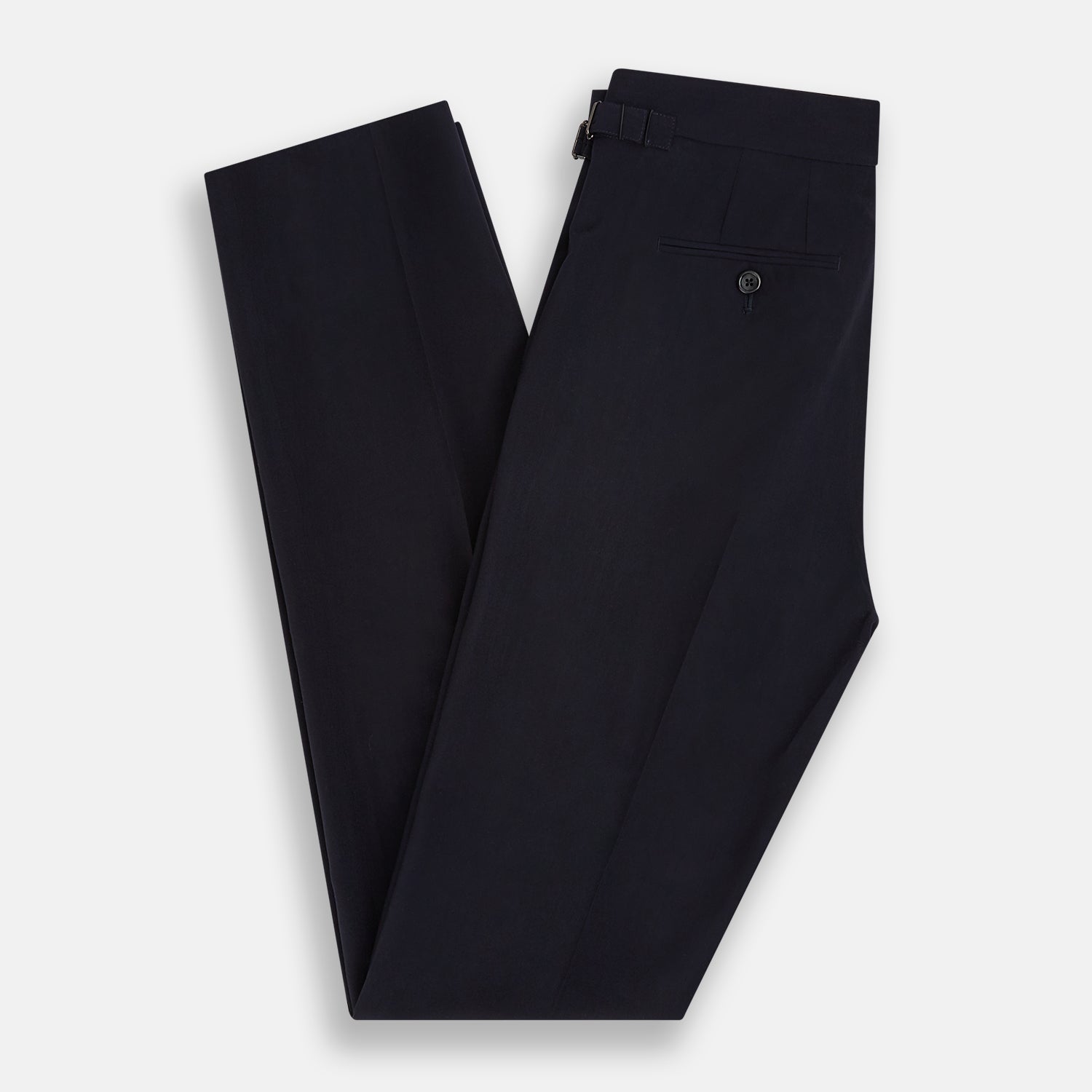 View 6 of product A pair of Midnight Blue Wool Henry Trousers by Turnbull & Asser, with a button closure and straight legs, shown against a plain white background.