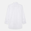 View 11 of product A woman with straight brown hair pulled back wears the Turnbull & Asser White Cotton Marlene Shirt, featuring classic menswear details, paired with high-waisted cream trousers against a neutral background.
