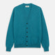 The Teal Lachlan Cashmere Cardigan by Turnbull & Asser features long sleeves, front pockets, and ribbed hem and cuffs. Displayed flat on a white background, this cozy piece is inspired by classic Scottish knitwear.