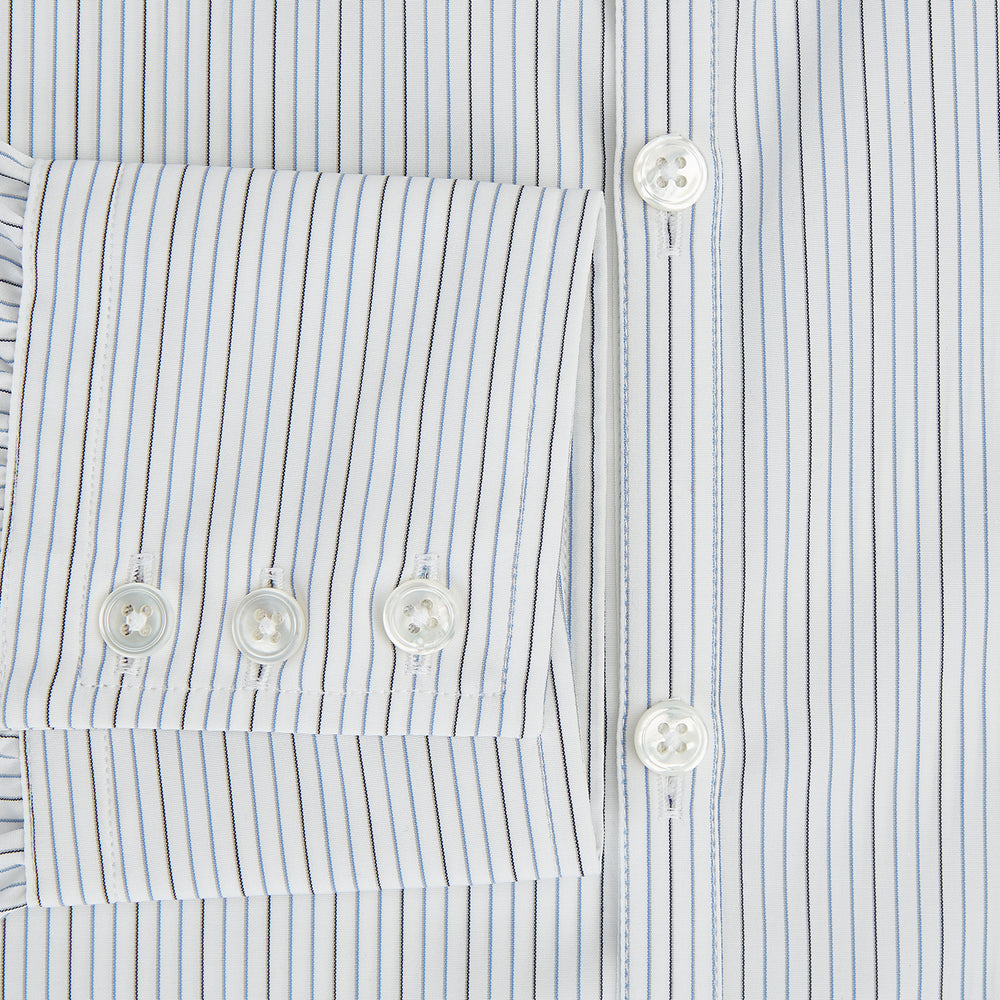 The Turnbull & Asser Grey and Blue Pinstripe Westminster Shirt features fine stripes, a classic collar, and buttoned cuffs—showcasing signature British craftsmanship against a plain white backdrop.