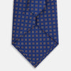 View 3 of product The Turnbull & Asser Bronze and Blue Multi Dot Silk Tie features a refined blue background with multicolored dots, elegantly displayed on a plain white backdrop—an ideal choice for a modern office look.
