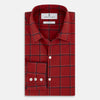 View 5 of product The Turnbull & Asser Dark Red Grid Check Windsor Shirt is a long-sleeved, button-up shirt with a dark red base and black and white grid pattern, displayed flat on a white background.