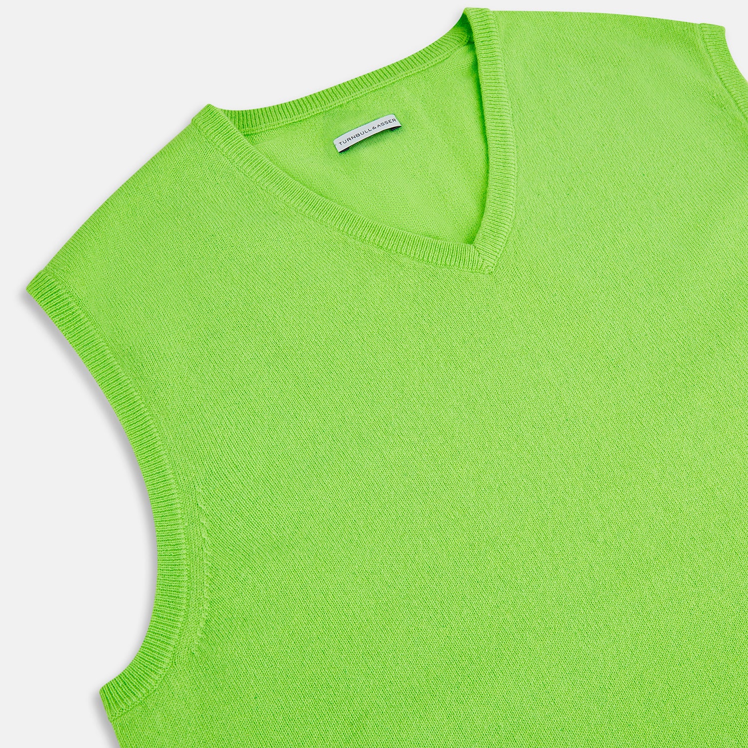 View 2 of product The Turnbull & Asser Lime Green V-neck Cashmere Vest features a sleeveless design and ribbed edges, shown against a plain white background.
