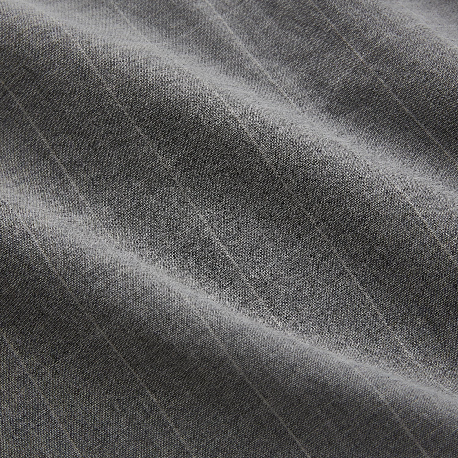 View 6 of product The Turnbull & Asser Grey Check Hampstead Overshirt features a light gray check pattern, pointed collar, chest pocket, and two zippered side pockets, displayed flat against a white background.